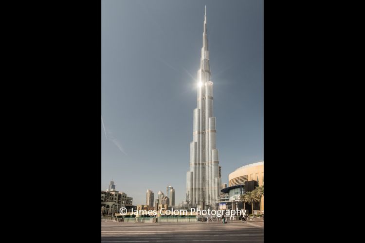 Burj Al Arab with sun reflecting on a clear day, Dubai, UAE