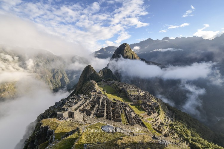 Machu Picchu with parting fog at sunrise, Peru