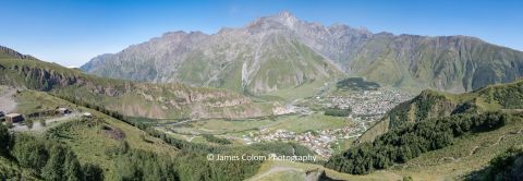 Panorama over Stepantsminda from Kazbegi Monastery in the Caucasus Mountains near Russian Border, Georgia